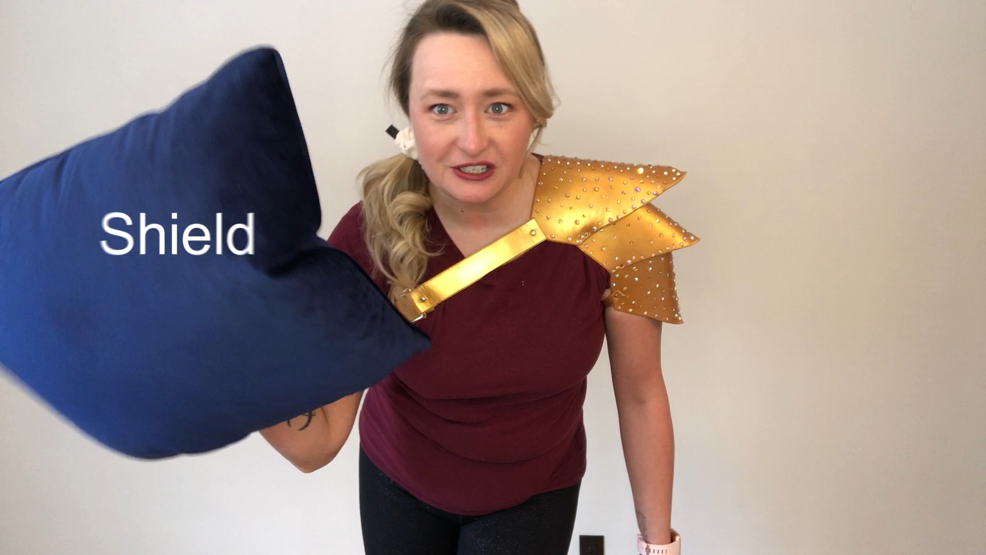 Brave knight folding up a pillow markeed: shield
